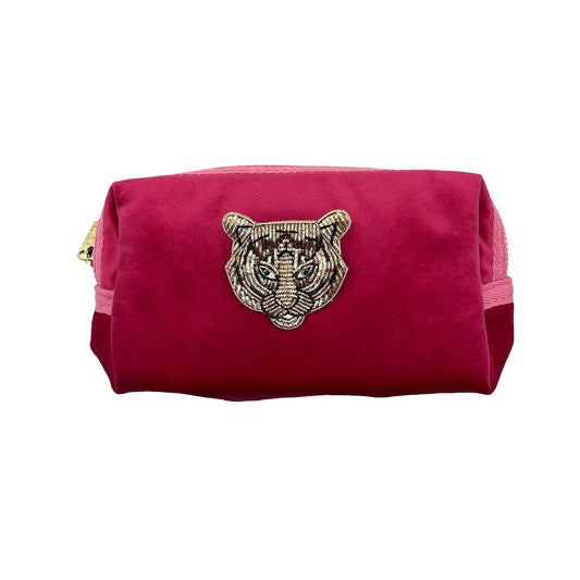 Bright pink makeup bag with Tiger Head brooch