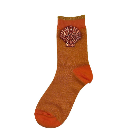 Tokyo socks in cantaloupe a coral shell brooch